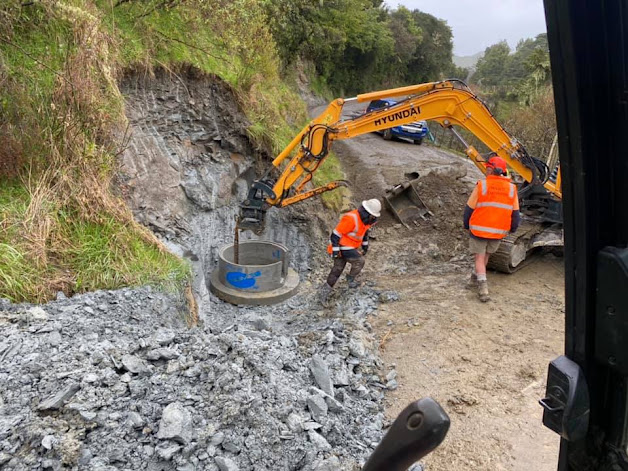 Excavator working in a rural cutting