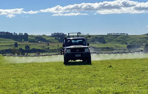 Agricultural spray ute crossing a field